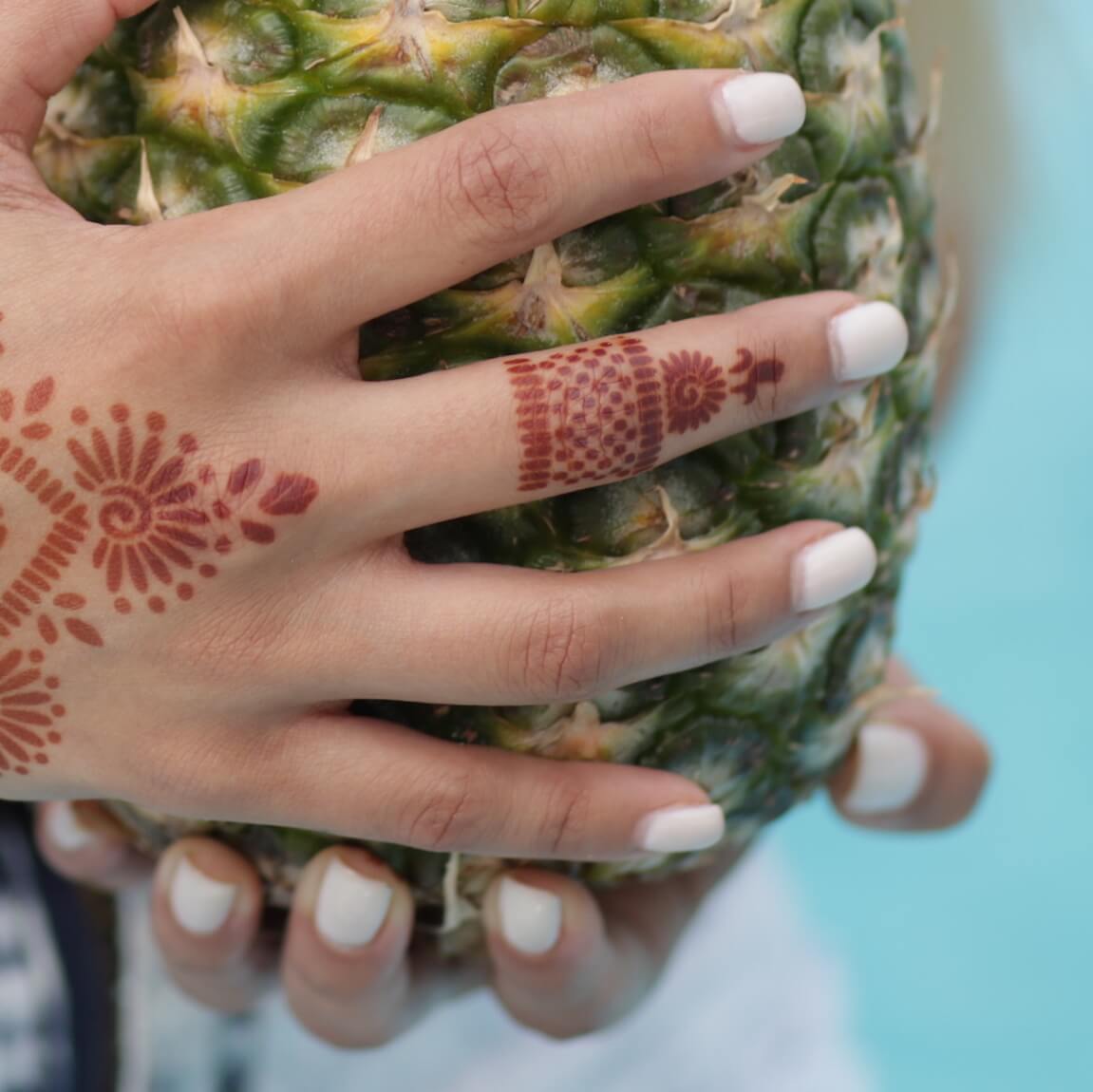 Radiant - model wearing ring henna design