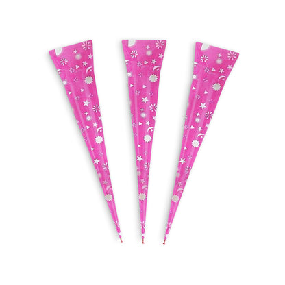 Three pink henna cones decorated with stars and moons.