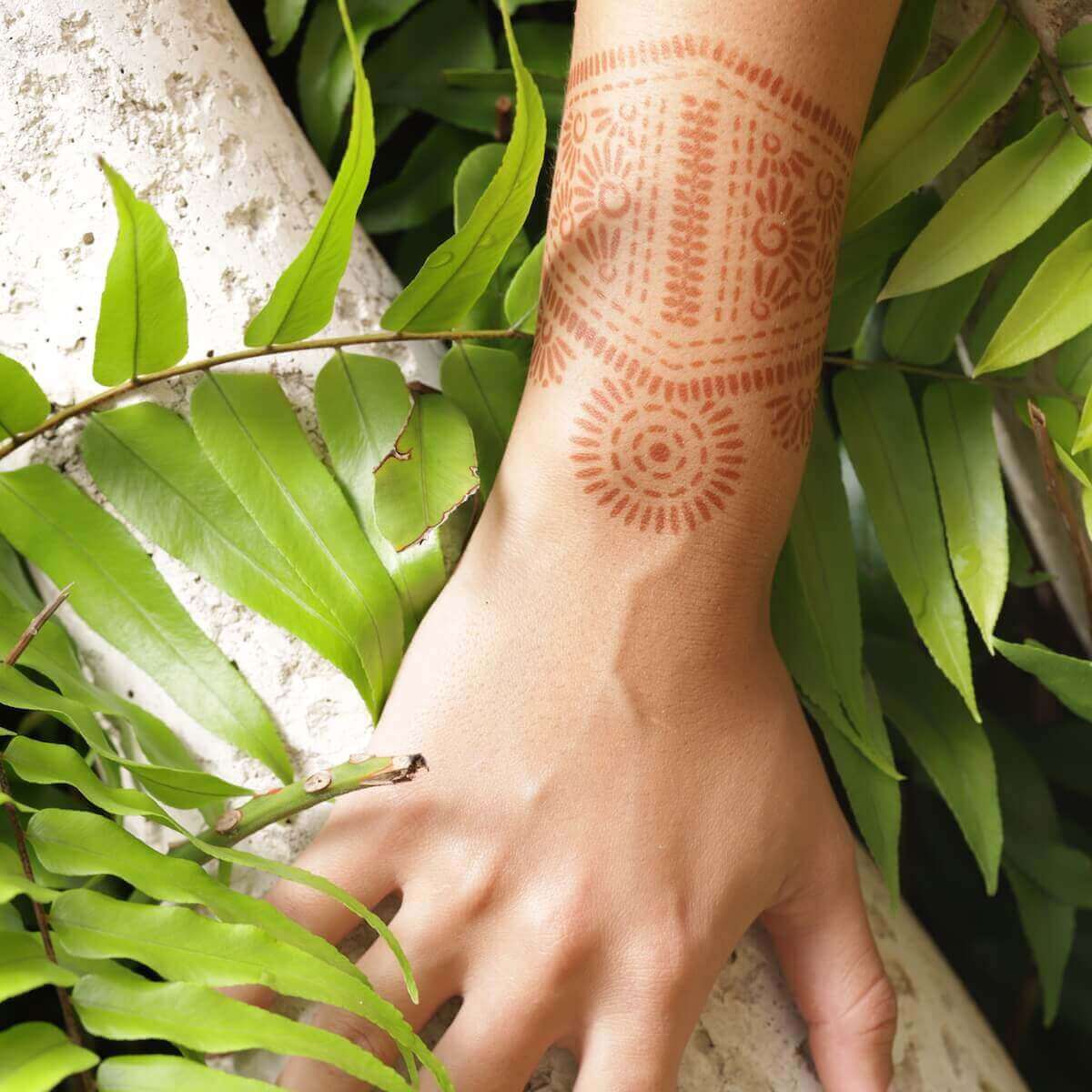 Aphrodite - bangle henna design on wrist in nature scenery