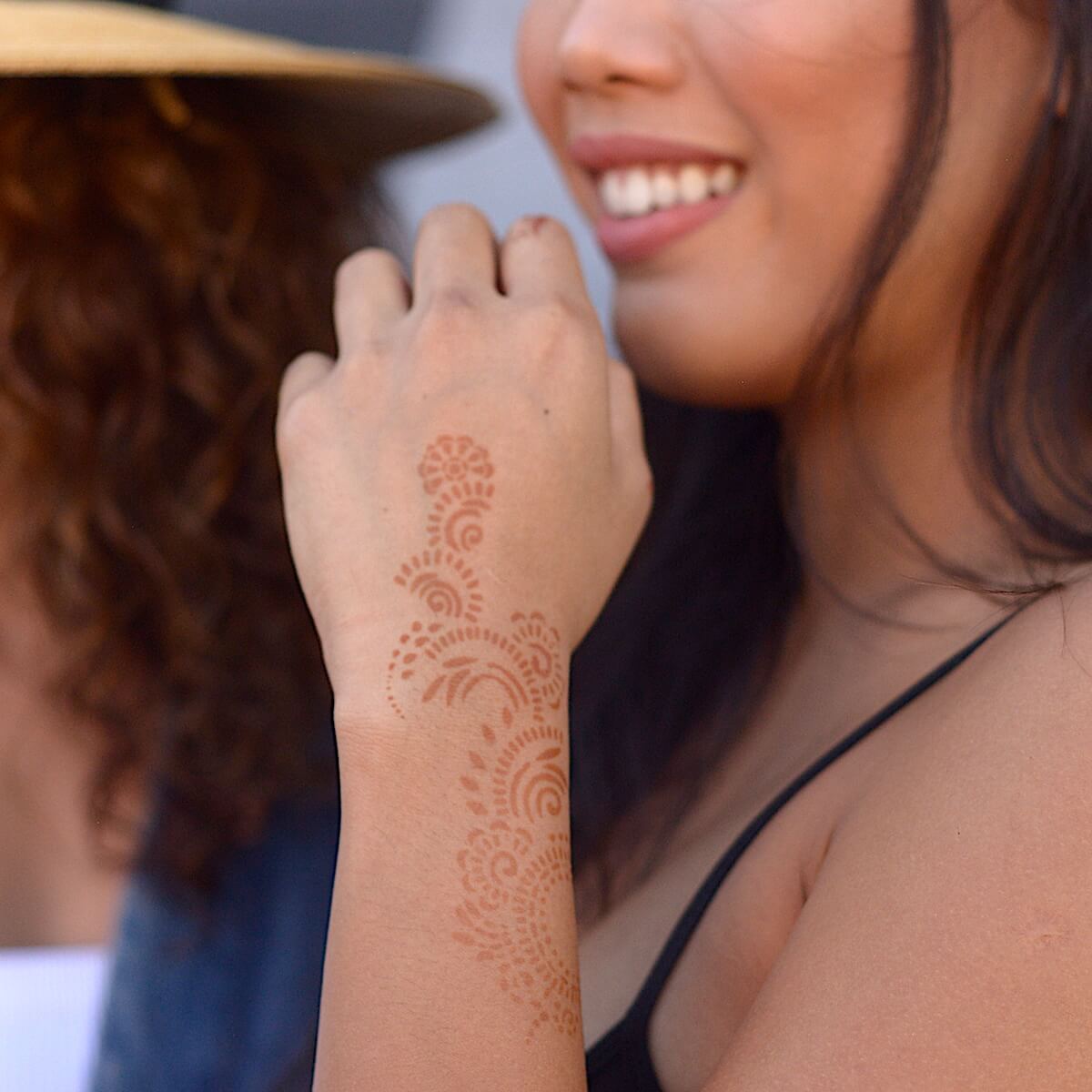 Athena - Woman with back hand henna tattoo