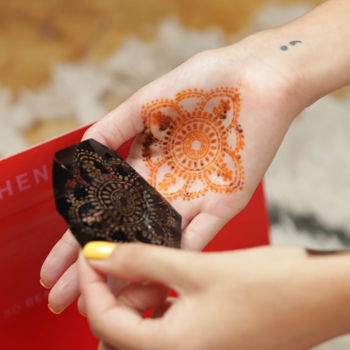 Blooms - removing henna stencil to reveal mandala henna tattoo