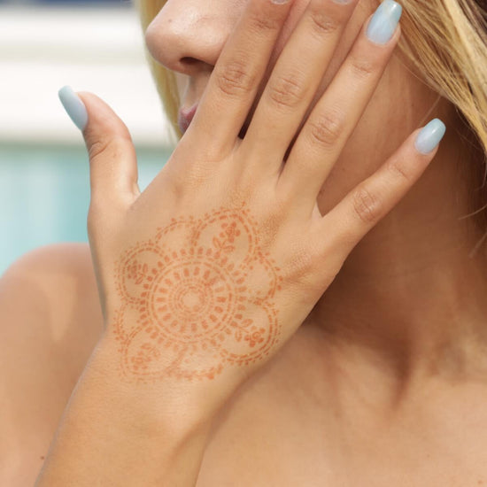 Blooms - henna tattoo of mandala on back of hand