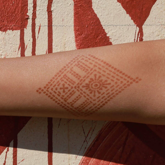 Fauzie - geometric henna tattoo on forearm