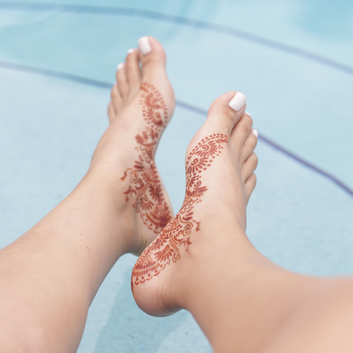 Fawn - foot henna design near pool