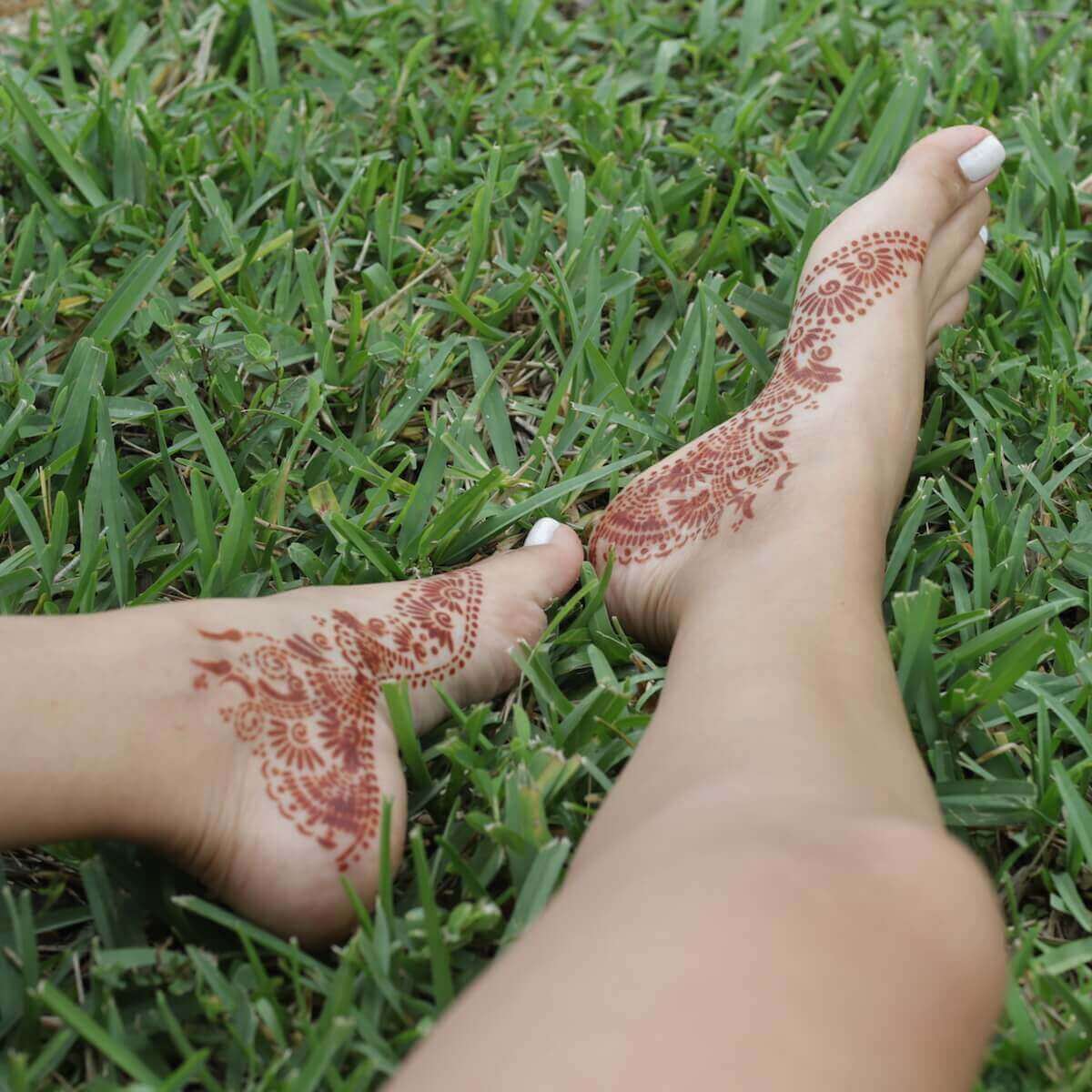Fawn - henna design on feet in grass
