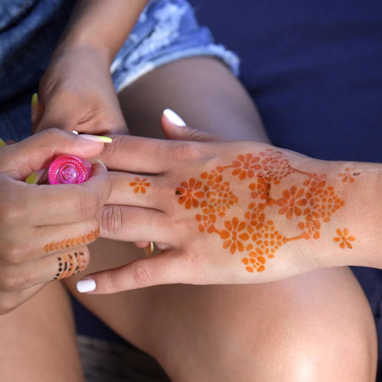 Flower Power - using coconut oil on floral henna tattoo on back of hand