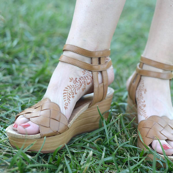 Ivy - Woman with henna tattoo on feet with sandals