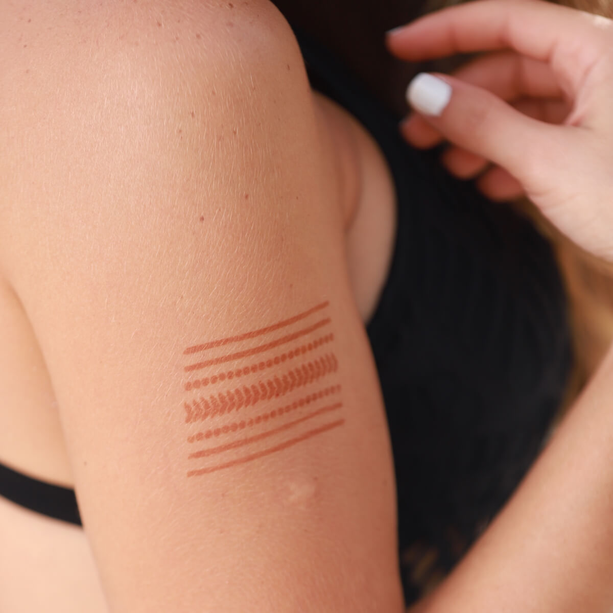 Miami - geometric henna design on upper arm