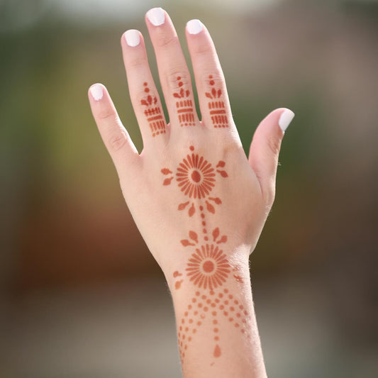 Pearl - geometric henna design on back of hand
