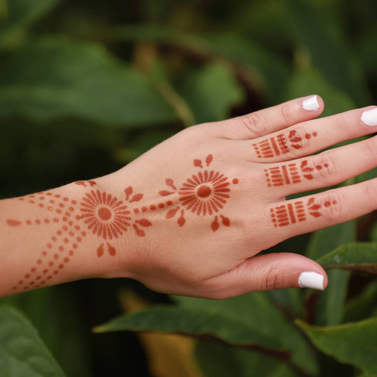 Pearl - back of hand henna design in nature setting