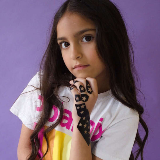 Stellar - girl with henna tattoo stencil on hand