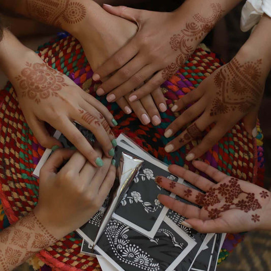 Group of women wearing henna designs