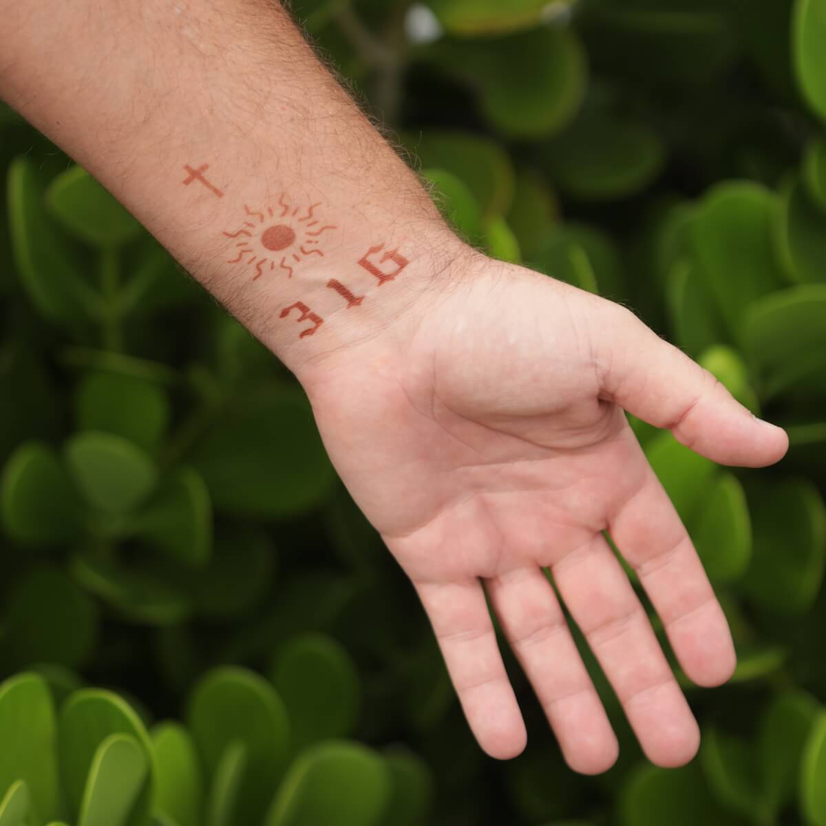 Gothic Numbers - modern henna tattoos on man's wrist