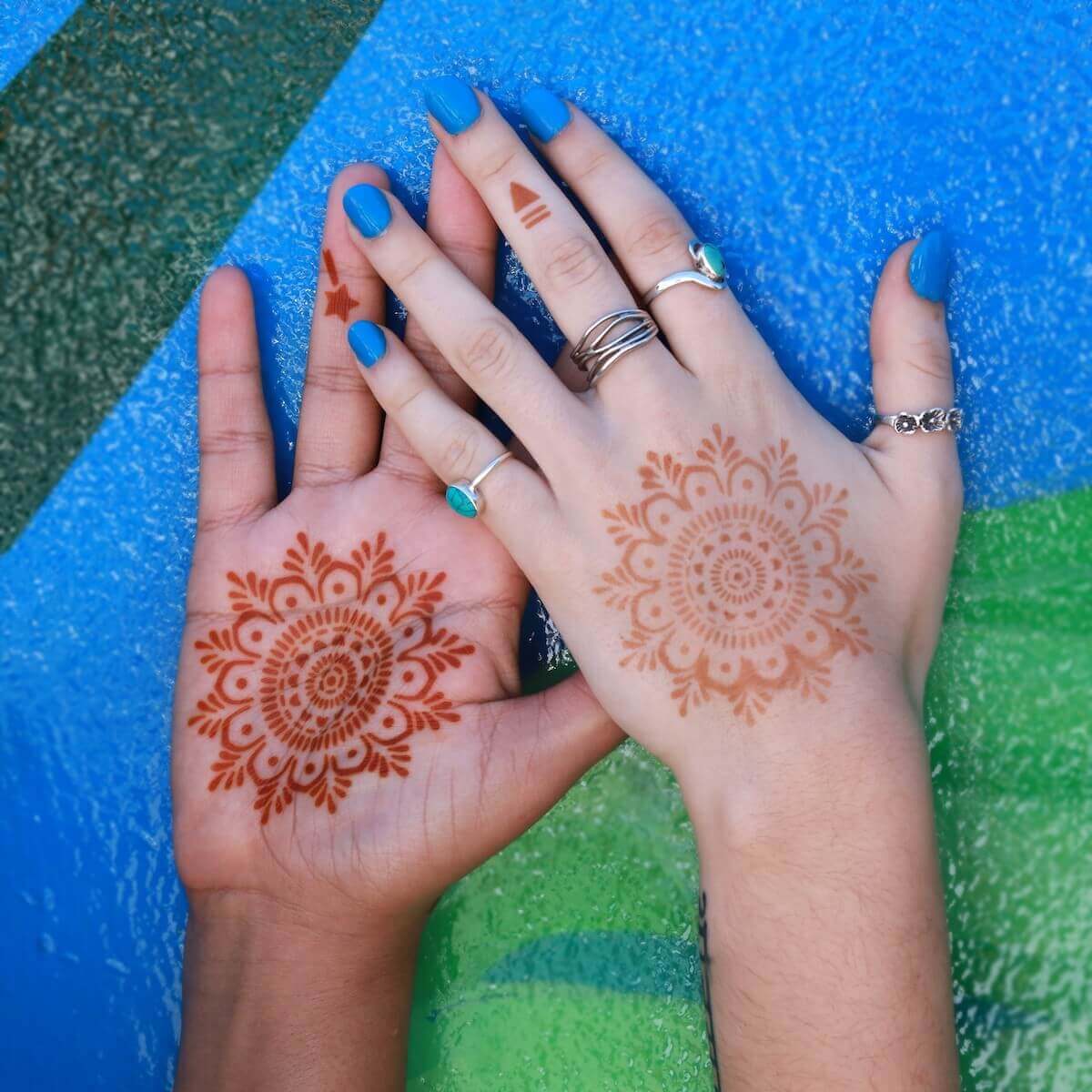 Haley - matching mandala henna designs on palms