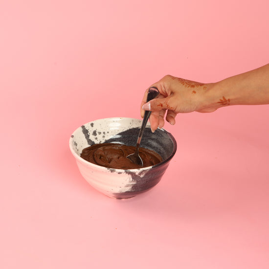 Creating henna paste in bowl - mixing all ingredients