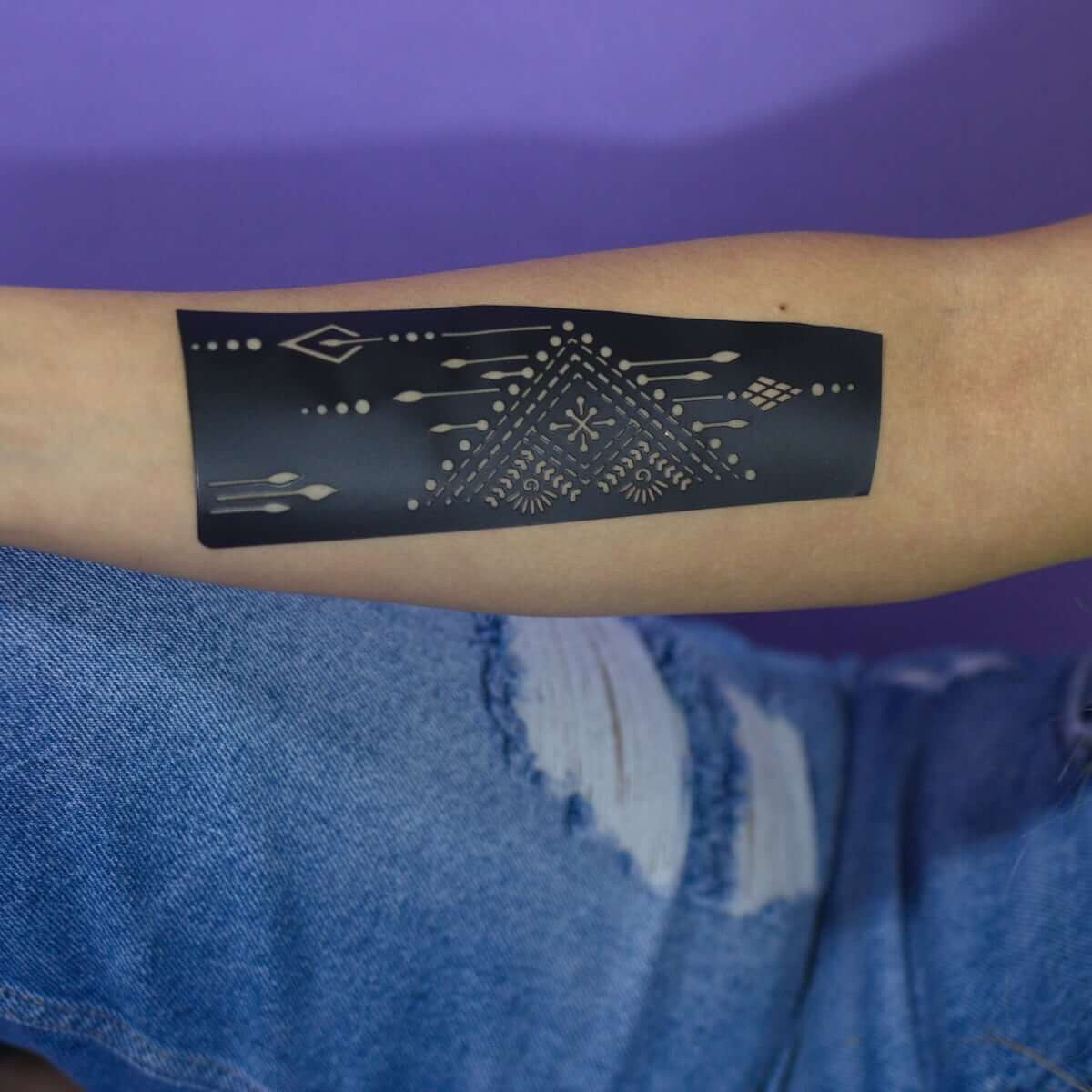 Ruma - Henna stencil on forearm before applying henna paste