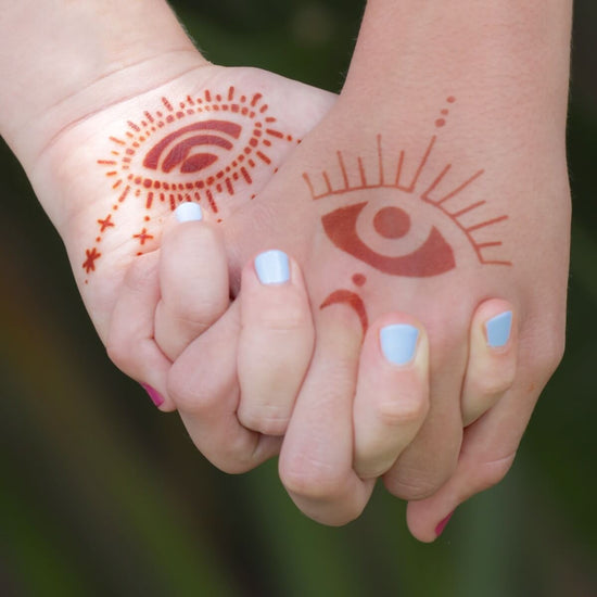 Starry Eyes - intricate eye henna tattoos on hands