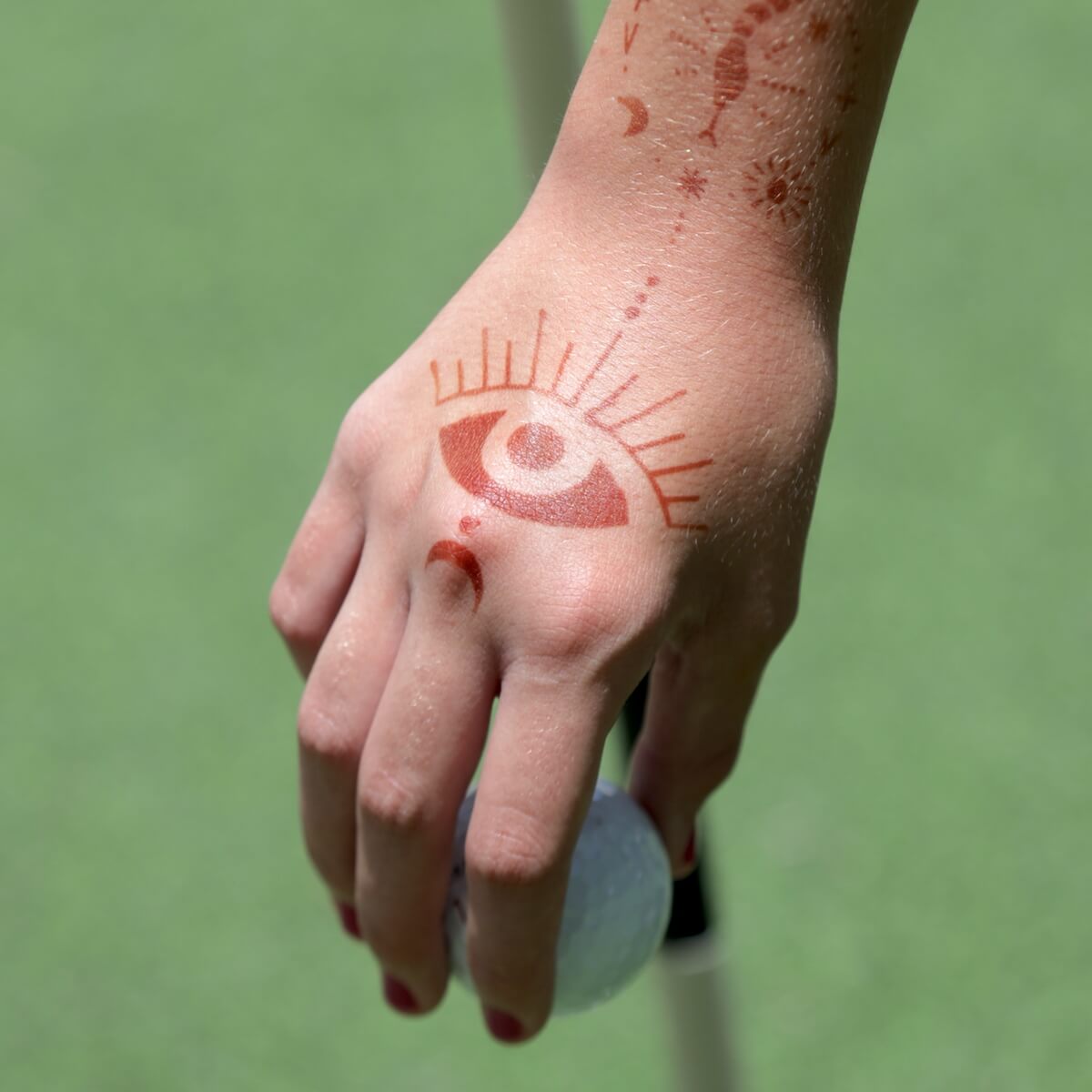 Starry Eyes - evil eye henna tattoo on back of hand
