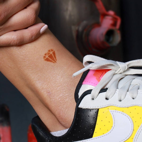 Ying - geometric diamond henna tattoo on ankle